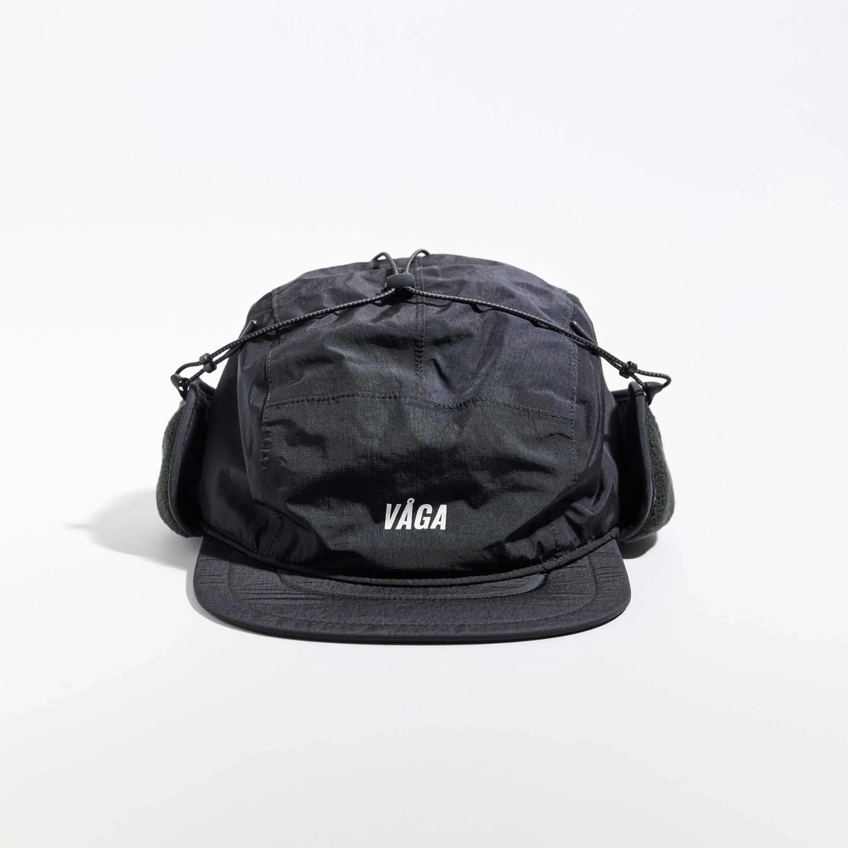 Vaga Padded Hiker Cap in black – front view with ear flaps fastened up