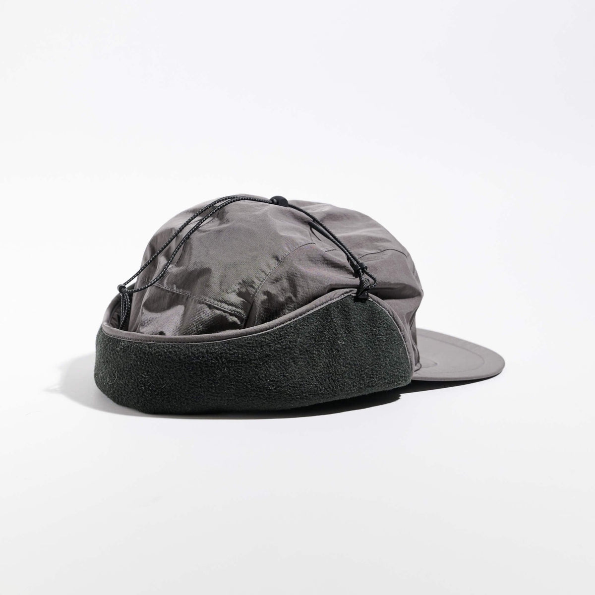 Vaga Padded Hiker Cap in grey – rear angle view with fleece band and ear flaps up